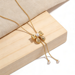 Bowknot pearl drop NCK/GOLD