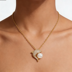 Dolphin Playing with freshwater pearl NCK/GLD
